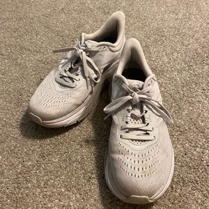 Hoka athletic shoes, light gray, in good condition. No holes